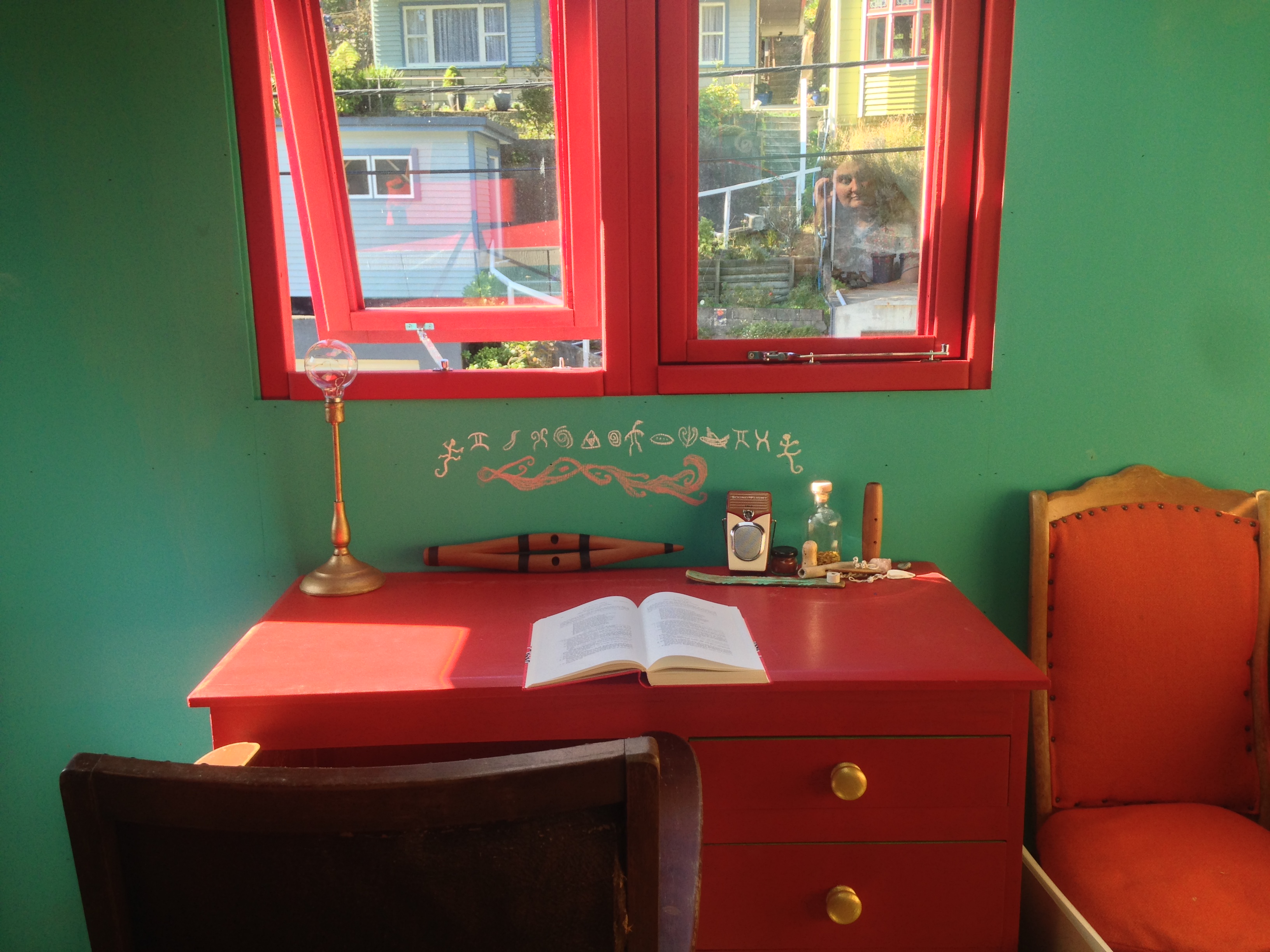 The desk in Ruby’s studio, as well as her putorino, taonga, and sketches of Kai Tahu cave art.